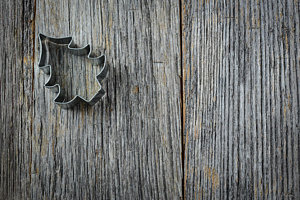 Wall Art - Photograph - Christmas Tree Cookie Cutter On Rustic Wood Background by Brandon Bourdages