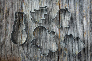 Wall Art - Photograph - Holiday Cookie Cutters On Rustic Wood Background by Brandon Bourdages