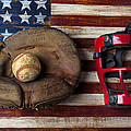 Catchers glove on American flag by Garry Gay