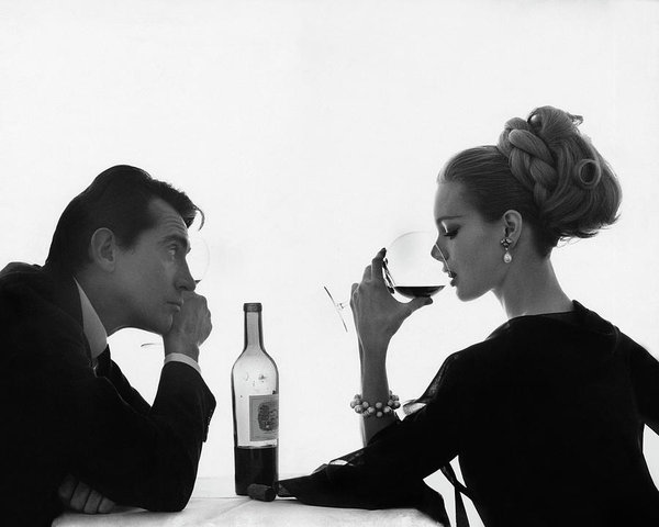 Wall Art - Photograph - Man Gazing At Woman Sipping Wine by Bert Stern