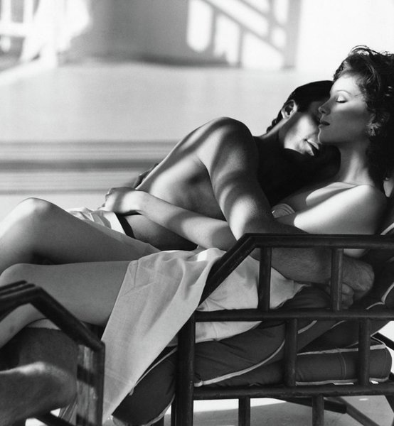 Wall Art - Photograph - Rosie Vela Resting In A Chair With A Male Model by Arthur Elgort