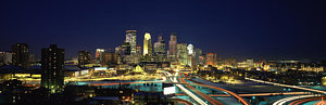 Wall Art - Photograph - Buildings Lit Up At Night In A City by Panoramic Images