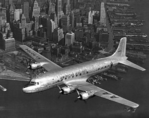 Wall Art - Photograph - American Dc-6 Flying Over Nyc by Underwood Archives