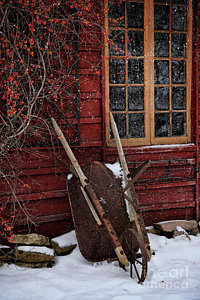Wall Art - Photograph - Old Wheelbarrow Leaning Against Barn In Winter by Sandra Cunningham