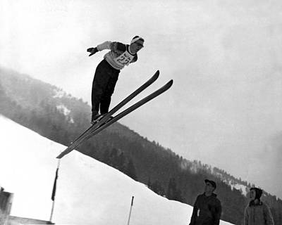 Wall Art - Photograph - Ski Jumper Takes To The Air by Underwood Archives