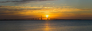 Wall Art - Photograph - Sunrise Over Sunshine Skyway Bridge by Panoramic Images