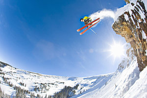 Wall Art - Photograph - Freestyle Skier Jumping Off Cliff by Tyler Stableford